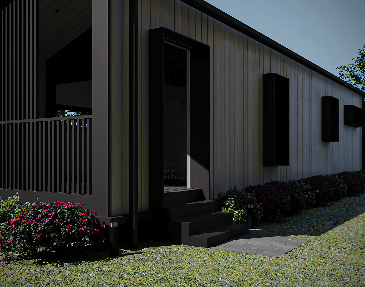 Evening side perspective with garden bollard lights illuminating the landscaped walkway along the side wall (Lexicon Half light grey vertical cladding with dark Basalt roof and trim, captured at twilight under warm architectural lighting).