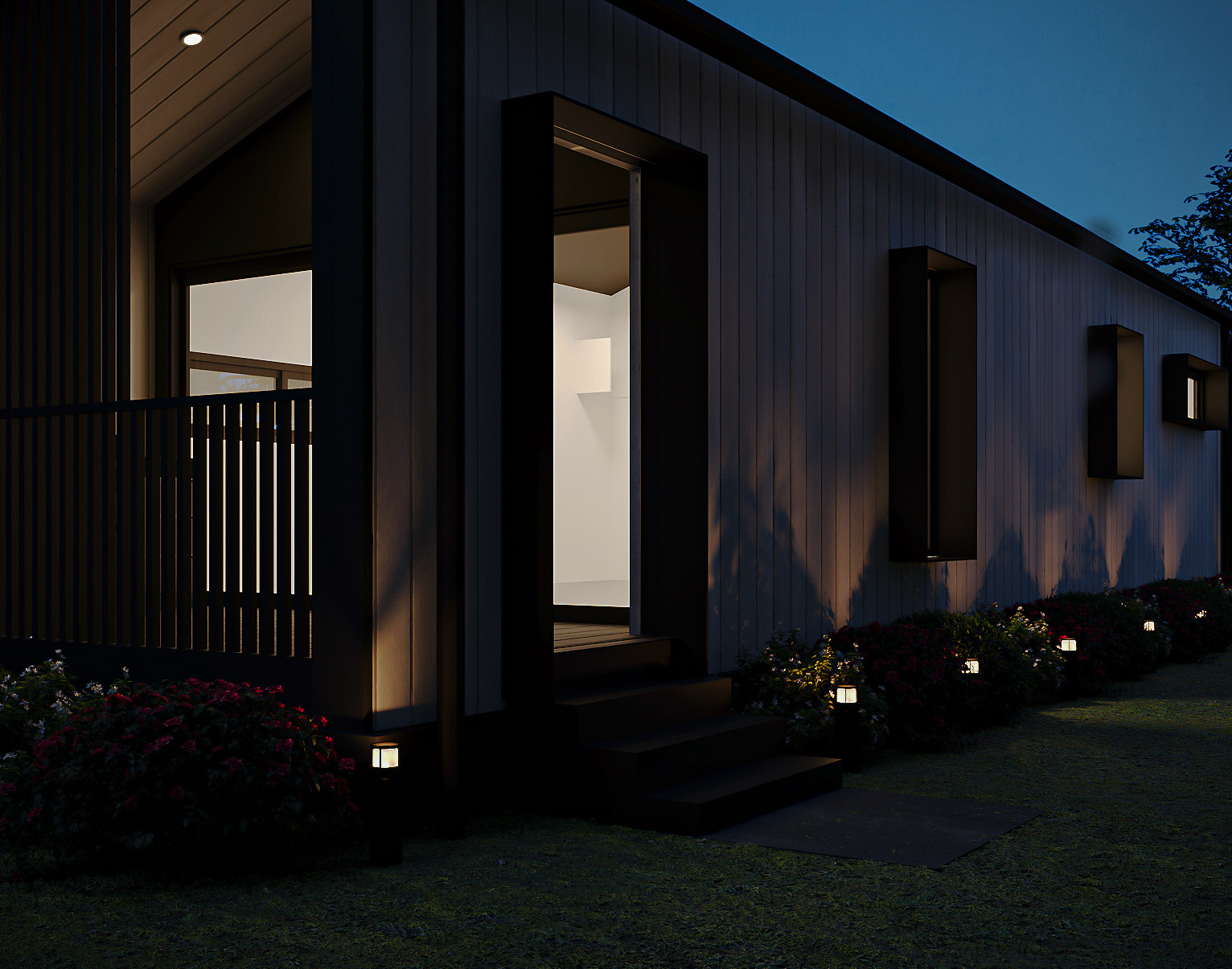 Rear exterior view showcasing the back gabled wall, narrow window, exterior air conditioning compressor unit, and perimeter fence (Lexicon Half light grey vertical cladding with dark Basalt roof and trim, captured at twilight under warm architectural lighting).