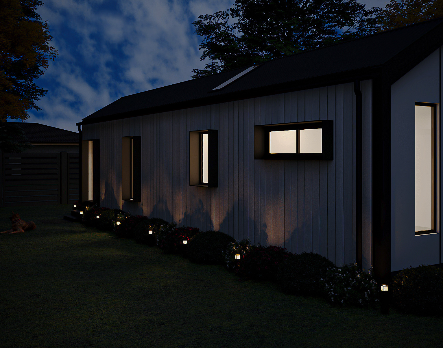 Night rear elevation highlighting dark roof silhouette, subtle interior window illumination, and garden backdrop (Lexicon Half light grey vertical cladding with dark Basalt roof and trim, captured at twilight under warm architectural lighting).