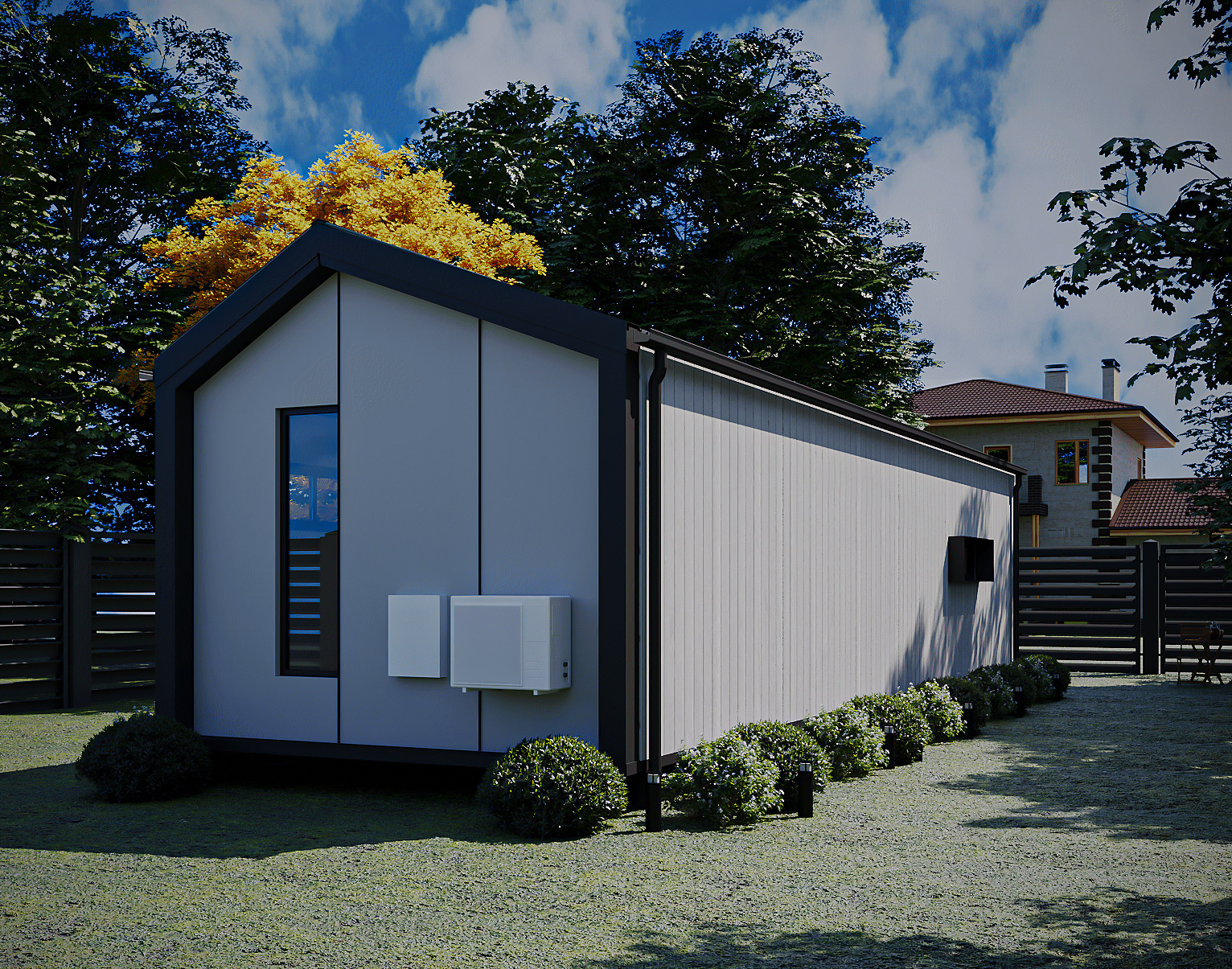 High-angle exterior perspective showing roofline, cladding detail, and surrounding yard fence (Lexicon Half light grey vertical cladding with dark Basalt roof and trim, captured under clear daylight).